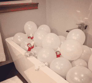 Elf on the Shelf Taking a Balloon Bath