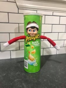 elf hiding in a pringles can