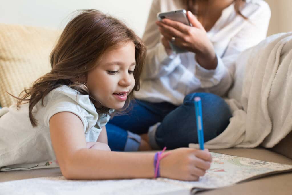 10 simple ways to limit screen time with children. Positive habit-forming ways to create an unplugged family life & raise healthier, more balanced children. 