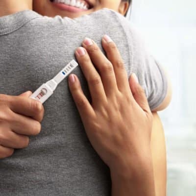 Woman Holding a Pregnancy Test