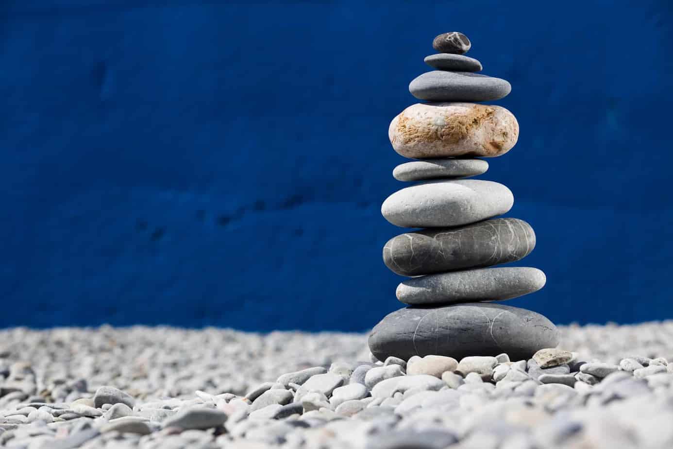 rock stacking is a fun kids outdoor activity in nature